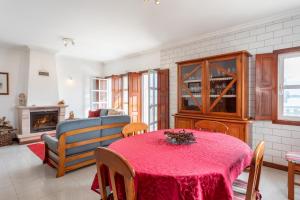a living room with a table and a couch at Biarritz - Varanda da Ria in Costa Nova