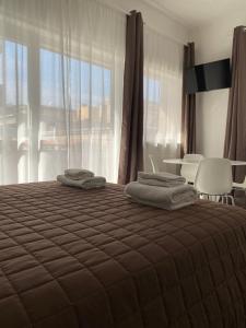 Postel nebo postele na pokoji v ubytování Quintino Sella rooms