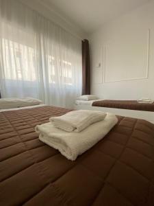 Postel nebo postele na pokoji v ubytování Quintino Sella rooms