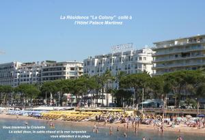 a group of people on a beach with buildings at Studette Cannes Croisette Martinez Area in Cannes +4 photos