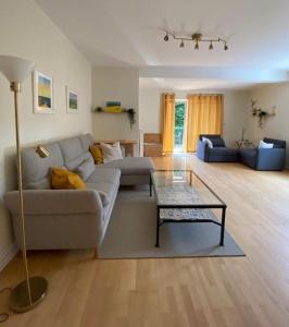 a living room with a couch and a table at Rohrbruch in Lansen