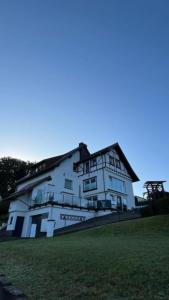 a white house with a painting on the side of it at Wellness Appartement Eifelglück in Pelm