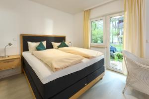 Postel nebo postele na pokoji v ubytování Thermen Appartements Gabriela, Appartement 24 qm