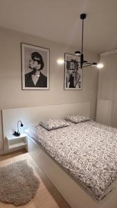 Posteľ alebo postele v izbe v ubytovaní ONE Apartament WROCŁAW