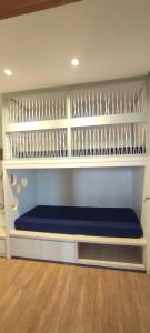 a shelf with a blue bench in a room at Comforto a Beira-Mar com Vista Deslumbrante in Barra Velha +38 photos