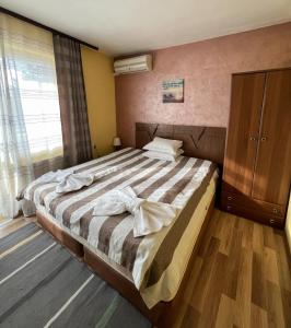 Postel nebo postele na pokoji v ubytování ALPHA family HOTEL