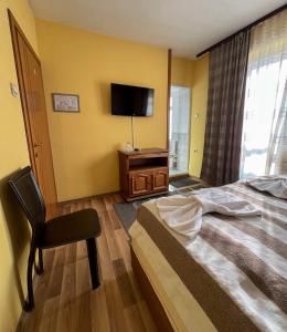 Postel nebo postele na pokoji v ubytování ALPHA family HOTEL