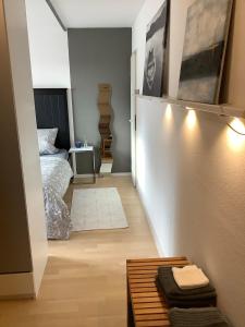 a bedroom with a bed and a table in a room at Hanni und Nanni in Haldenwang