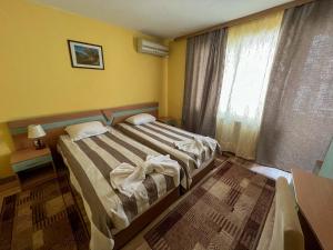 Postel nebo postele na pokoji v ubytování ALPHA family HOTEL