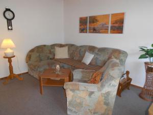 a living room with a couch and a table at Ferienhaus Köllner in Fischbach