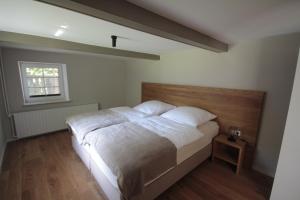 Postel nebo postele na pokoji v ubytování Hus Boompecker