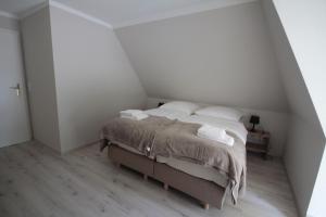 Postel nebo postele na pokoji v ubytování Hus Boompecker + 5 fotografií