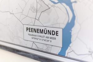 a map with a sign that reads pernumidatehaichickstudentcharters at Hausboot Chalet am Meer - LP8 in Peenemünde