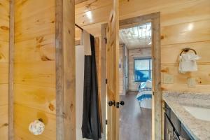 a kitchen in a tiny house at Honeybear Hideaways - Luxury Gatlinburg Smoky Cabin with Indoor Pool and Hot Tub in Gatlinburg