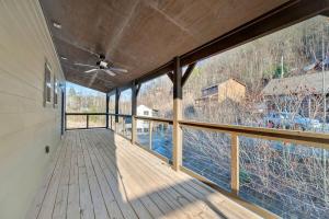 an empty balcony with a view of the water at Honeybear Hideaways - Luxury Gatlinburg Smoky Cabin with Indoor Pool and Hot Tub in Gatlinburg