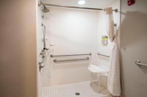 a bathroom with a toilet and a towel rack at King Bed Hotel Room 152 in Jackson