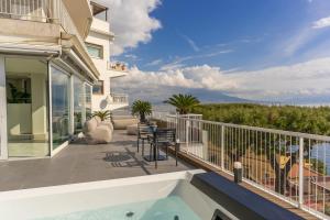 a balcony with a view of the ocean at Petrarca Boutique Apartment - Sofia Apartments in Naples