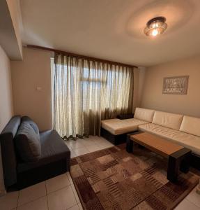 Posezení v ubytování ALPHA family HOTEL