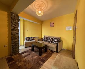 Posezení v ubytování ALPHA family HOTEL