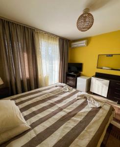 Postel nebo postele na pokoji v ubytování ALPHA family HOTEL