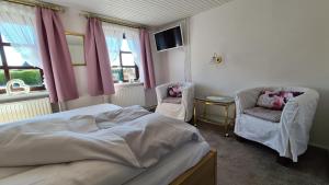 Postel nebo postele na pokoji v ubytování Appartement Nummer 26