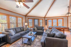 a living room with couches and a pool table at Gatlinburg Smoky Mountain Cabin Amazing Views in Gatlinburg +39 photos