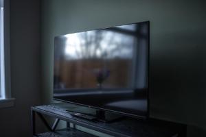 a large flat screen tv sitting on a table at Bank House in Livingston