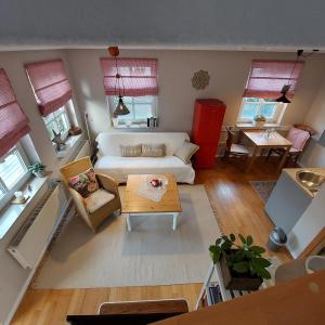 a living room with a couch and a table at "NordWest" Ferienwohnung in Prerow