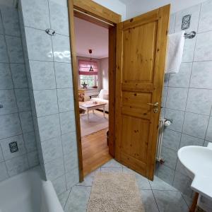 a bathroom with a shower and a toilet and a sink at "NordWest" Ferienwohnung in Prerow