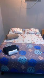 Ένα ή περισσότερα κρεβάτια σε δωμάτιο στο Pousada FlAT Mundo SL