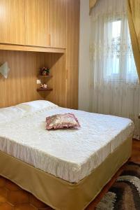 a large bed in a bedroom with a window at La Perla Marina - Furnari in Torre Forte