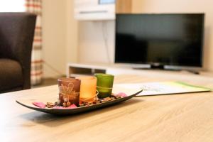a plate with candles and nuts on a table at Familienhof Brüning - Ferienwohnung Hofblick in Meppen