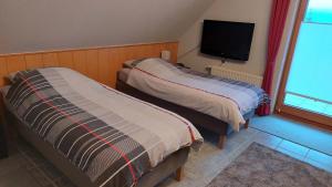 Postel nebo postele na pokoji v ubytování Ferienwohnung Bell im Brohltal