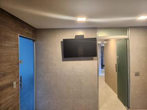 TV a/nebo společenská místnost v ubytování Apart Hotel Champagnat UN1206