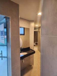 TV a/nebo společenská místnost v ubytování Apart Hotel Champagnat UN1206