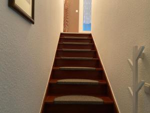 a stairwell in a building with wooden steps at Wohnung im 2 Familienhaus in Dortmund