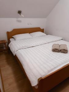 Postel nebo postele na pokoji v ubytování Apartma Neja Rogla