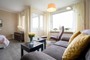 a living room with a couch and a table at Apartment Plön Seeblick in Plön