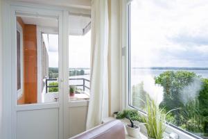 a large window with a view of the water at Deluxe Quartier am Plöner See - Hallenbad kostenlos in Plön