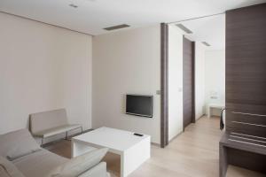 TV a/nebo společenská místnost v ubytování NH Castellón Mindoro
