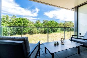 a living room with a table and a large window at Loft Lori in Buhlitz