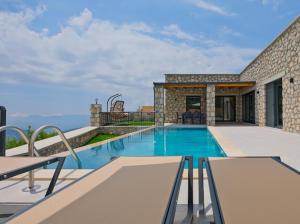 a swimming pool in the middle of a house at Villa TEPE in Arsaköy