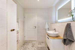 Koupelna v ubytování Ferienhof Marquardt Bungalow 4 + 5 fotografií