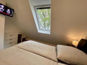 Ein Bett oder Betten in einem Zimmer der Unterkunft FeWo Eich im Emsland