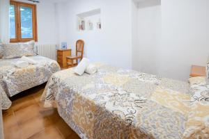 Posteľ alebo postele v izbe v ubytovaní Casa Joana - Apartamento Lo Pamano + 7 fotografií