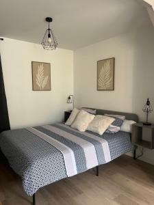 Postel nebo postele na pokoji v ubytování Cottage du charme