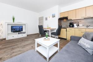 Kuchyň nebo kuchyňský kout v ubytování Ferienwohnungen Haus Boje "Wattwurm" + 17 fotografií