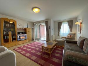 a living room with a couch and a table at Apartment 22 in Wilhelmshaven