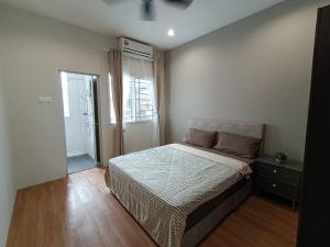 Ένα ή περισσότερα κρεβάτια σε δωμάτιο στο Empire Citystay at Moyan-4Queen