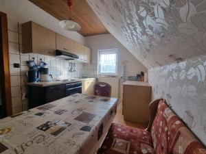 a small kitchen with a table and a counter top at Fewo Janssen in Borkum